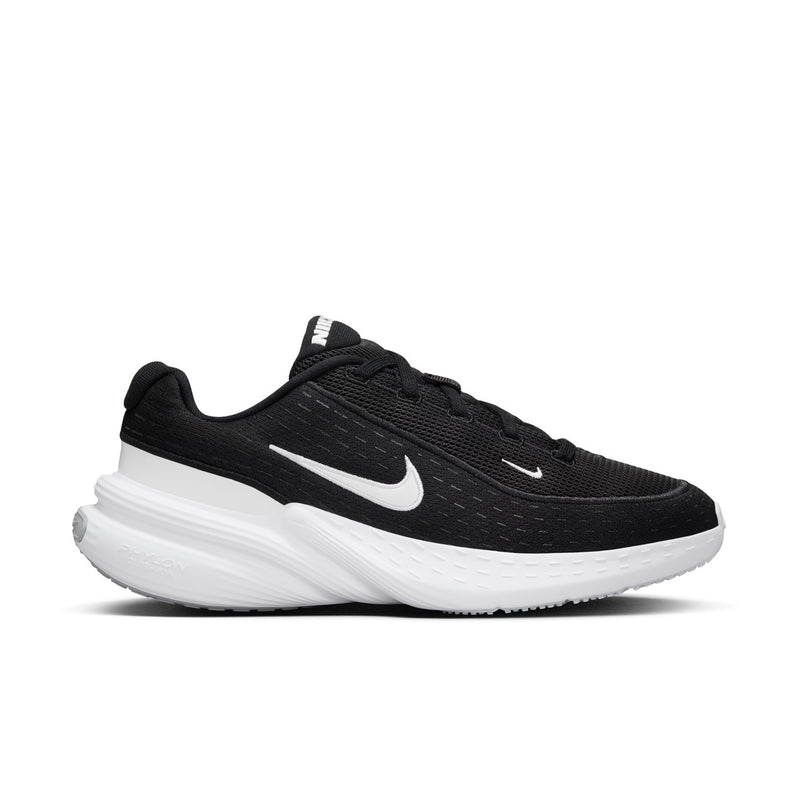 Black knit women's running sneaker with white Nike swoosh and cushioned sole