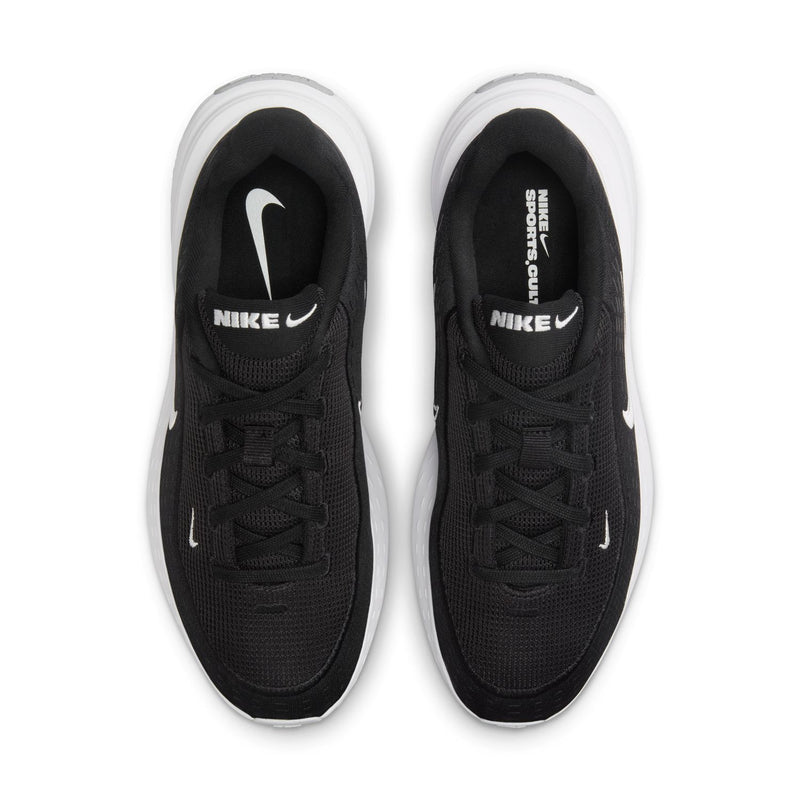 Pair of black women's sneakers with white swooshes on front and black laces