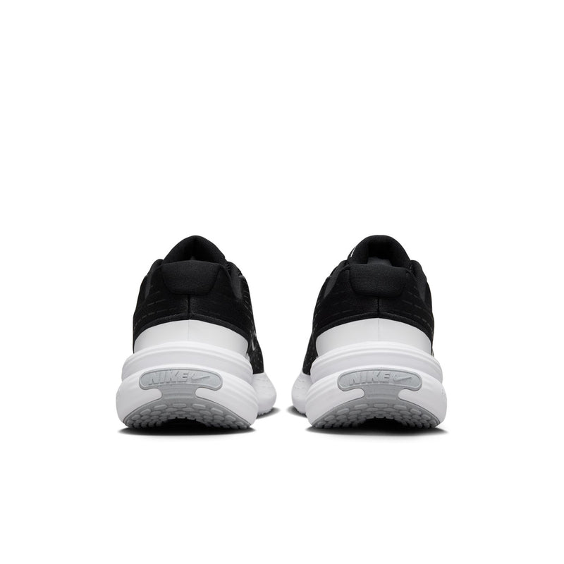Black women's sneakers with white heel details and cushioned platform sole