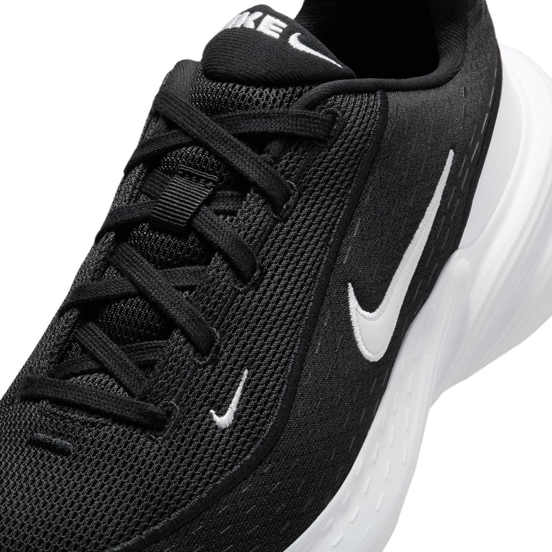 Black mesh upper women's sneaker with white swoosh and lace-up design
