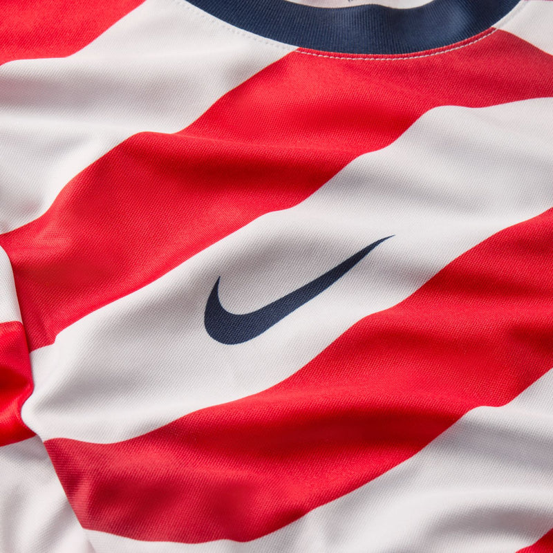 USA supporter tee close-up: Nike swoosh on red and white striped fabric