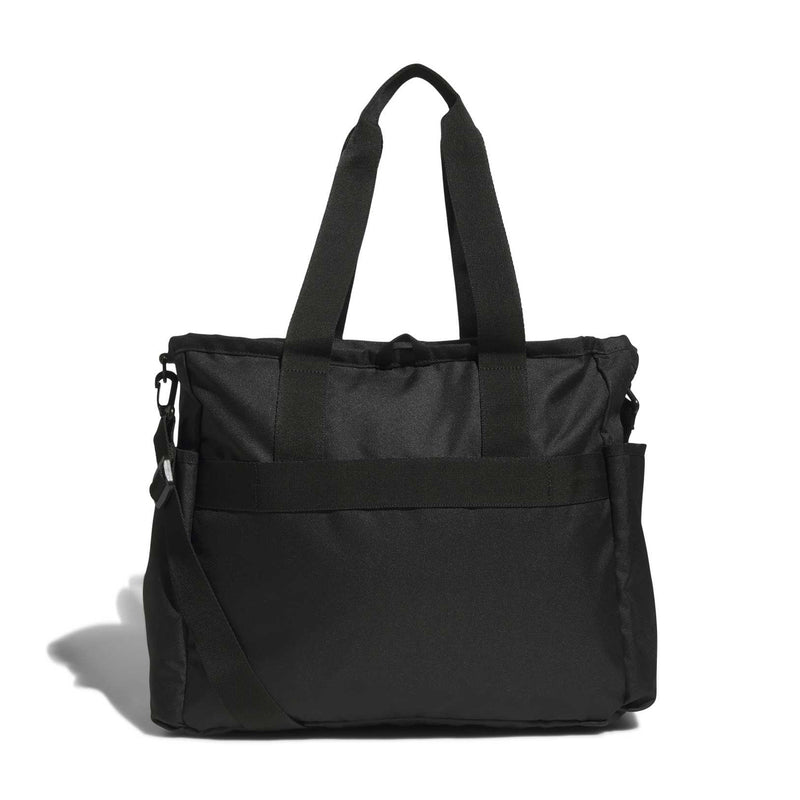 Black tote bag with dual top handles and side zip pockets, minimalist front panel.