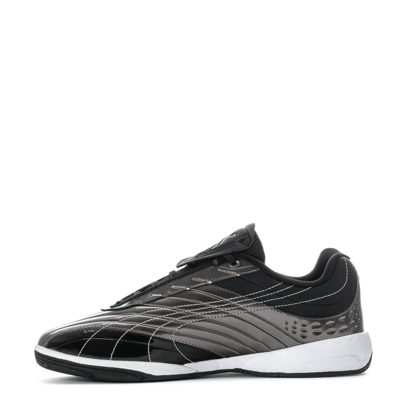 Black lace-up athletic shoe with silver panel stripes and white outsole edge