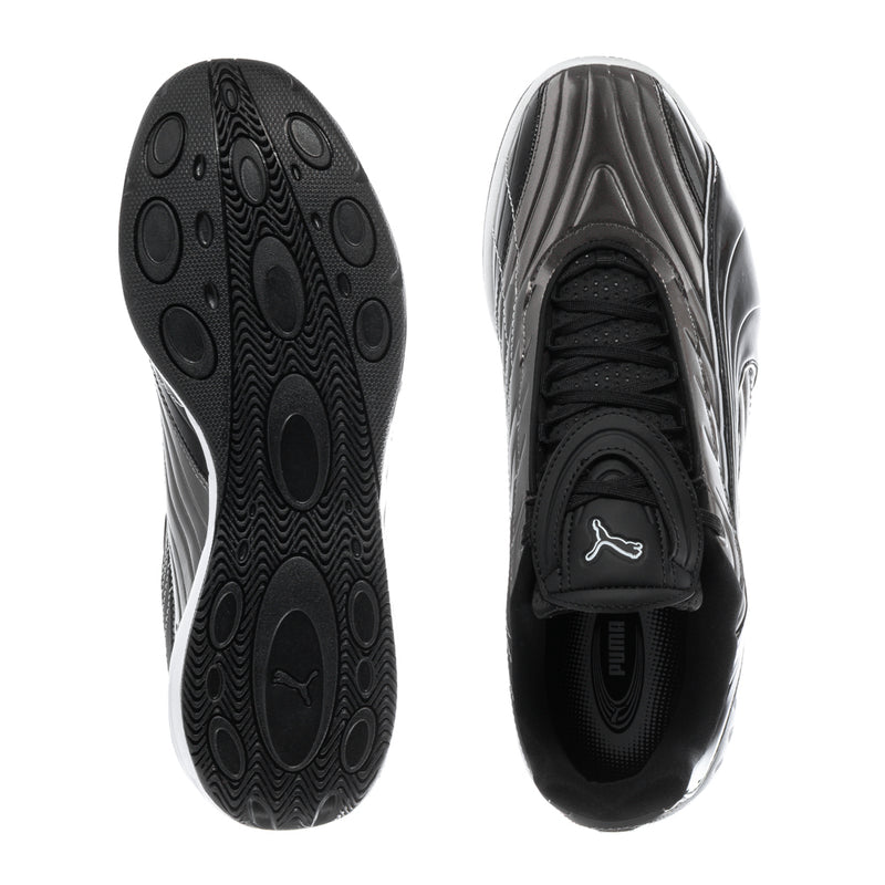 Shoe outsoles showing textured tread on black sole with white sidewall