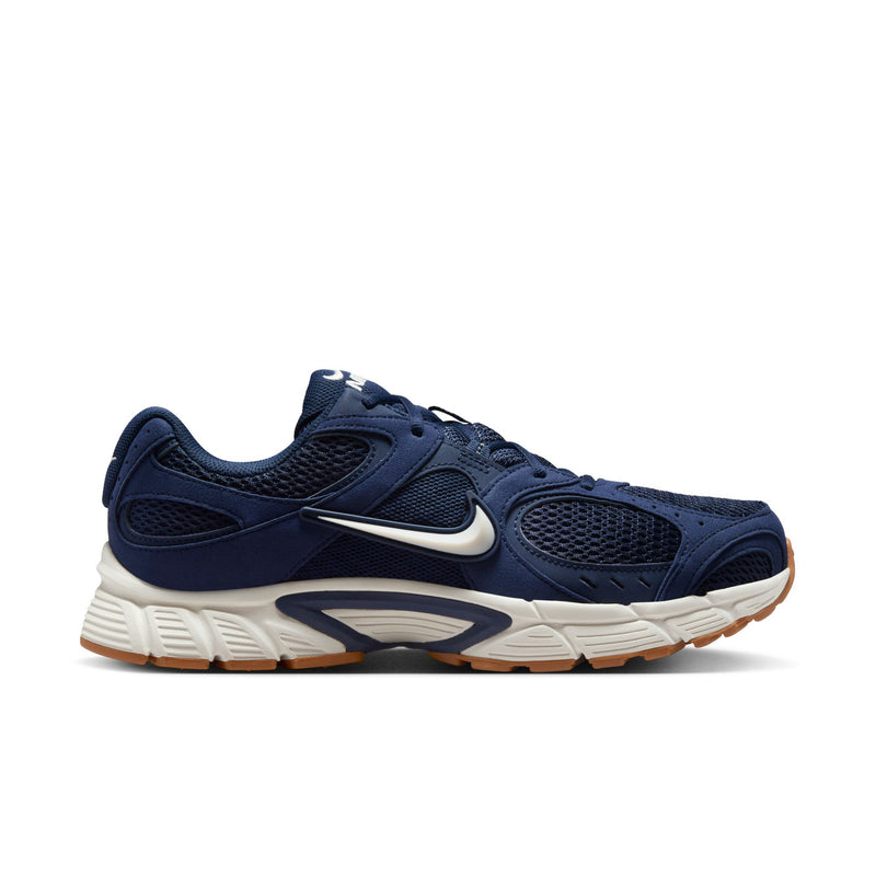 Men's navy and white lace-up sneakers with tan rubber outsole