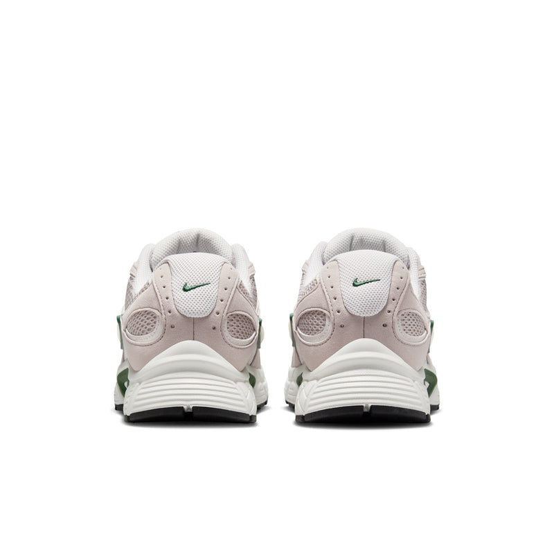 Back view of light gray NIKE sneakers with green detailing and white heel tabs