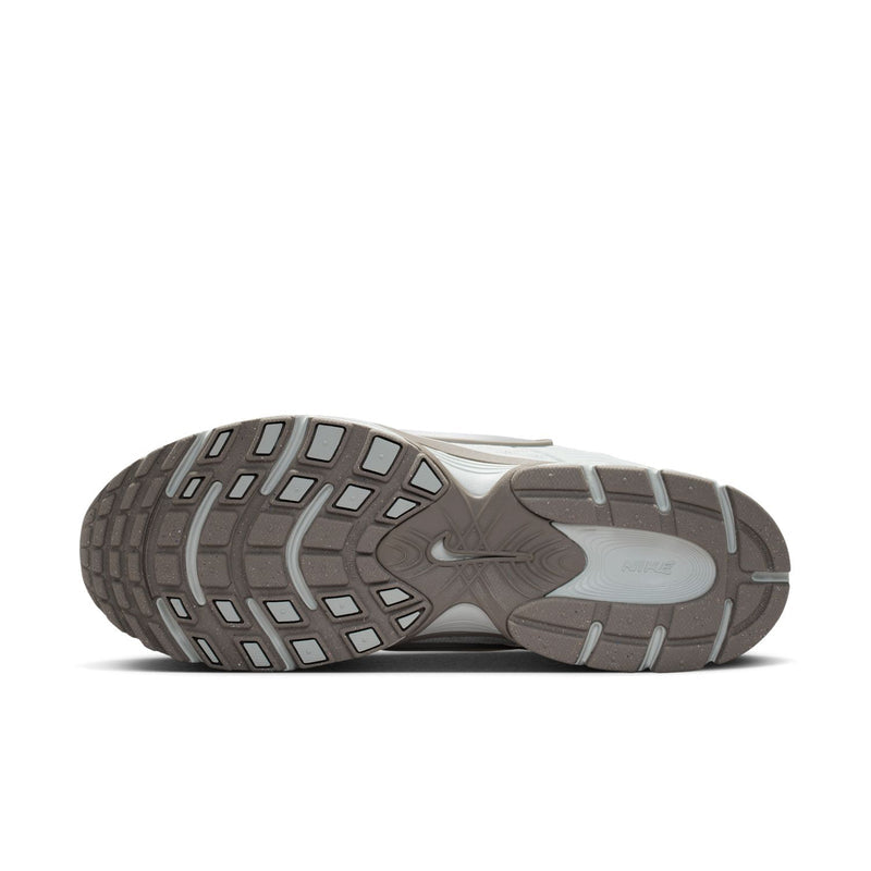 Men's outsole view running shoes, patterned dark gray tread with light silver upper