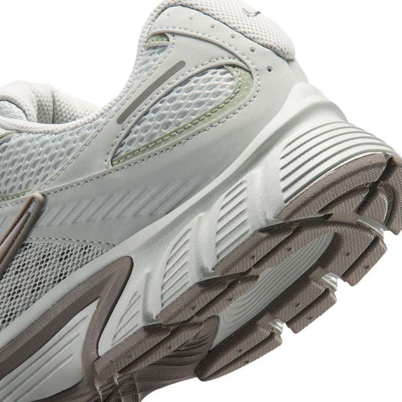 Men's shoe close-up, light silver mesh with ribbed midsole and textured outsole