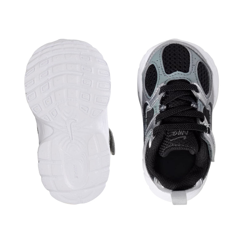 Toddler sneaker sole view: white outsole and dark upper with lace fastening
