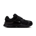 Black womens wide athletic sneaker with mesh panels and Nike Swoosh, lace-up.