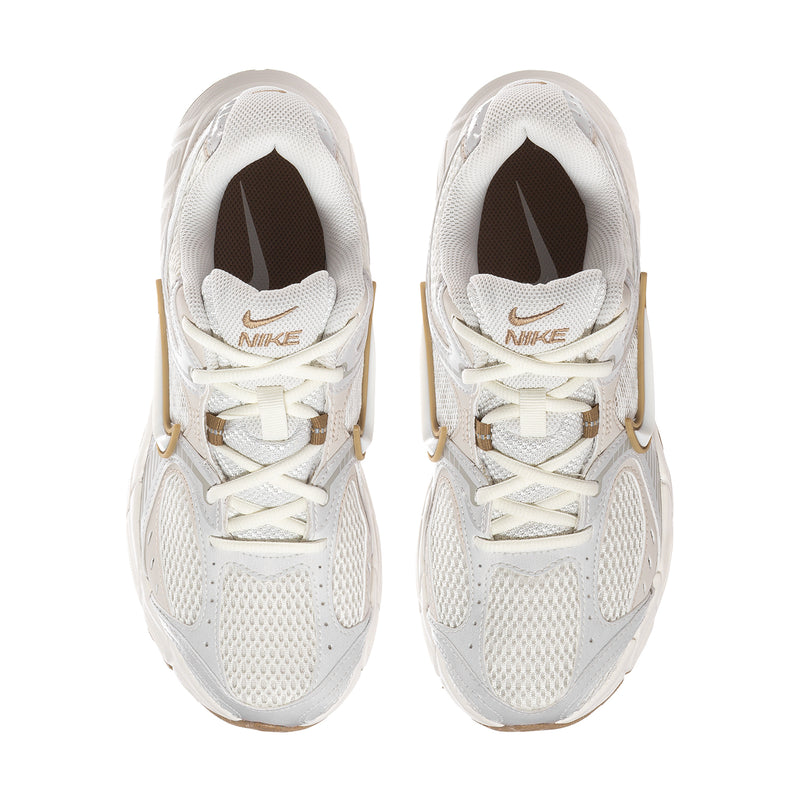 Women’s athletic sneaker pair viewed from the front, white mesh with tan liners