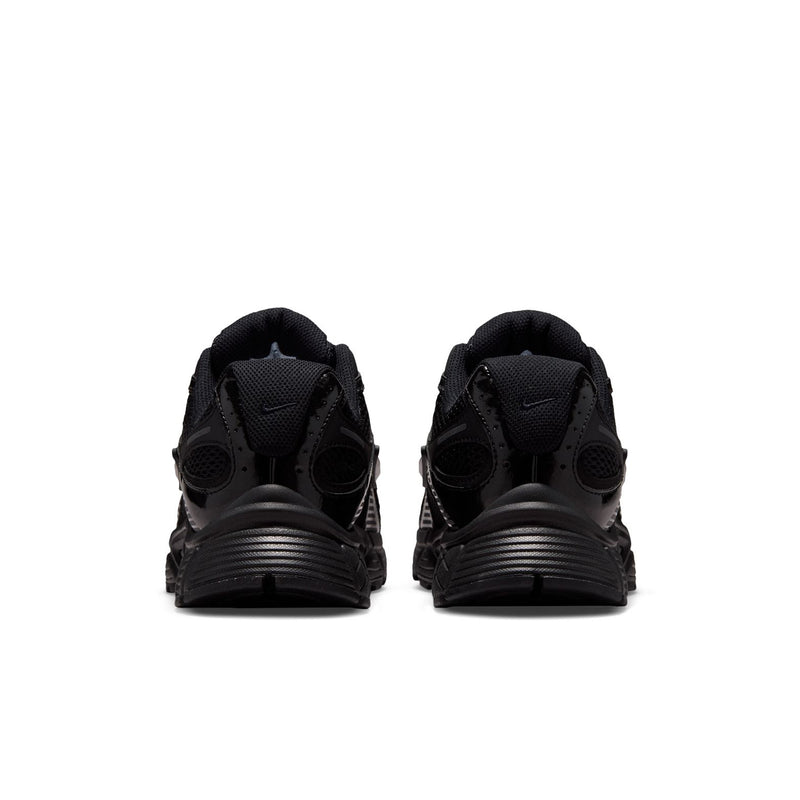 Black womens wide athletic sneakers, rear view with cushioned heel and lace-up collar.