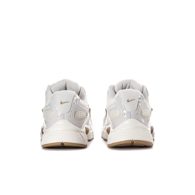 Women’s athletic sneaker rear view in white with tan heel and gold branding