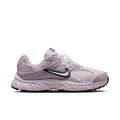 Women's lilac Nike running sneaker with black Swoosh and cushioned sole