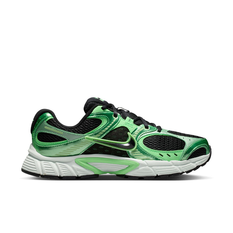 Women's green and black running shoes with white sole and Nike swoosh