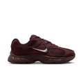Women's burgundy athletic sneakers with silver swoosh and textured upper