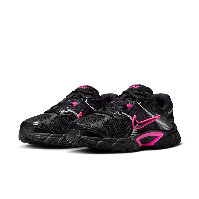Women's black running shoes with pink trims, lace-up, dual swoosh details