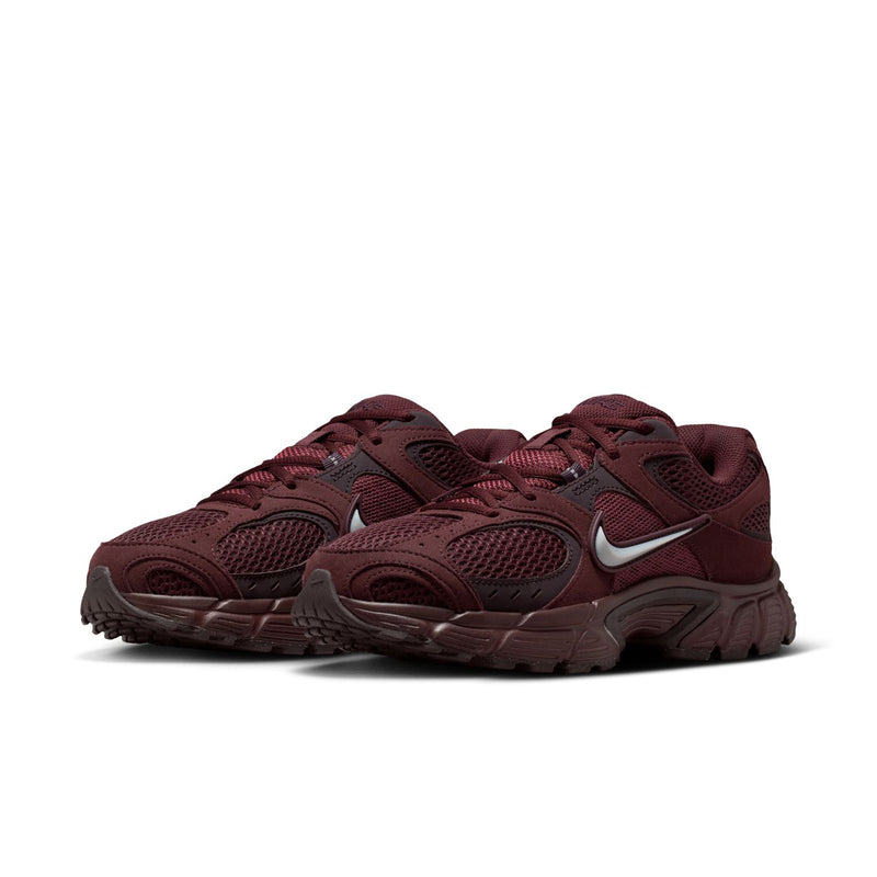 Women's burgundy athletic sneakers with silver swoosh and mesh panels