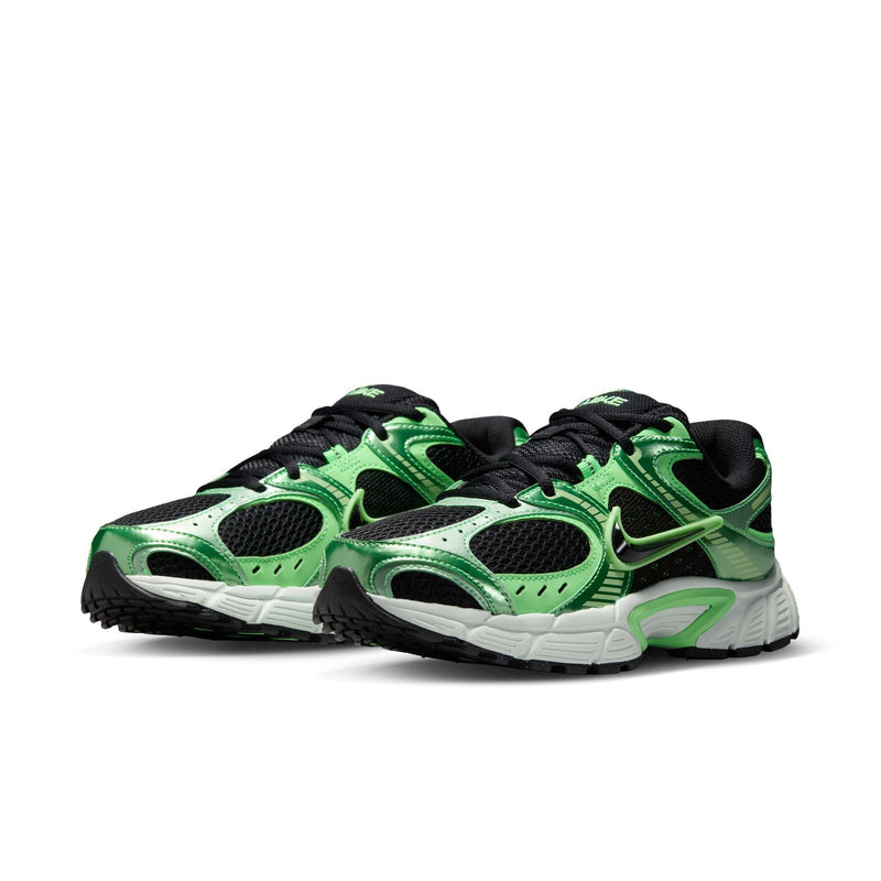 Women's green and black running shoes with white sole and visible Nike logo
