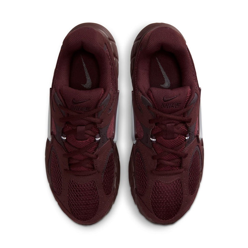 Women's burgundy lace-up sneakers with padded tongues and Nike logo