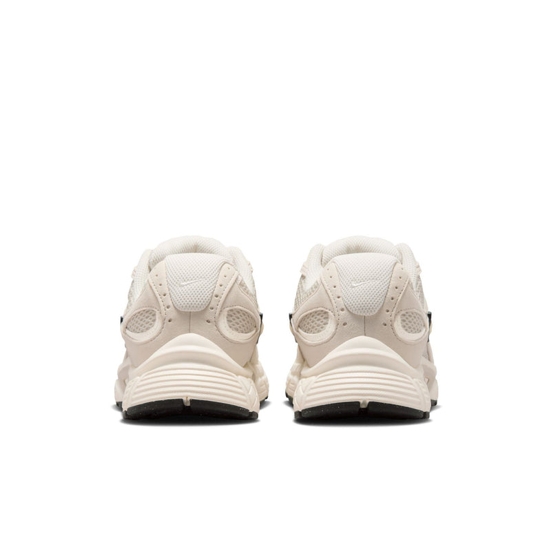 Womens cream lace-up running sneaker heel with cushioned back and black outsole