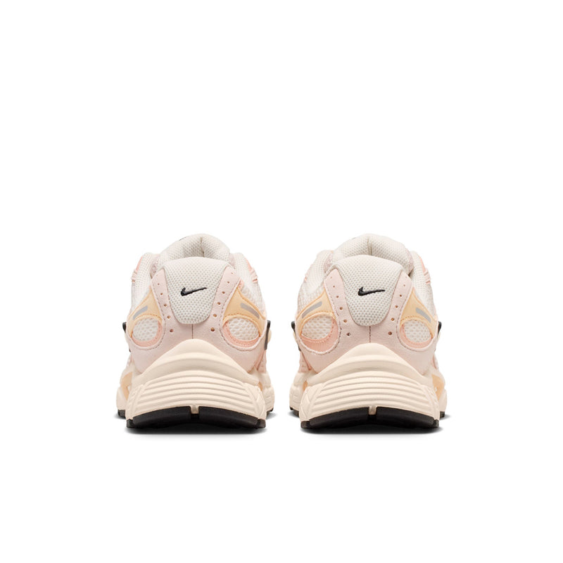 Heel view of pale pink women's running shoes with Nike logo and cushioned sole