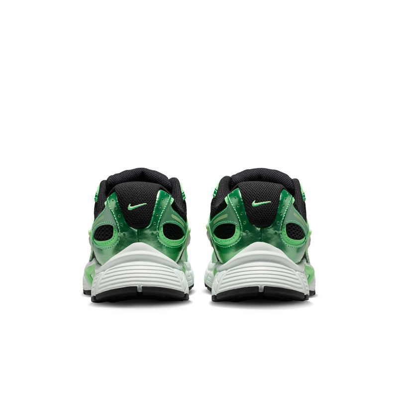 Women's green and black running shoes with white heel midsole and Nike swoosh