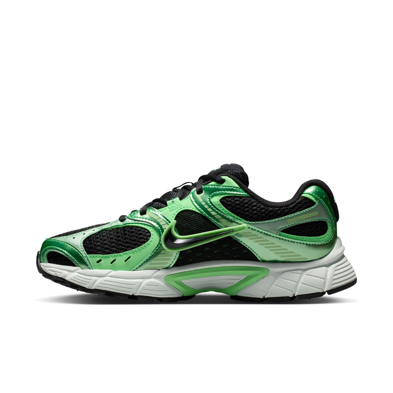 Women's green and black running shoes with white sole, green lace panel, Nike swoosh
