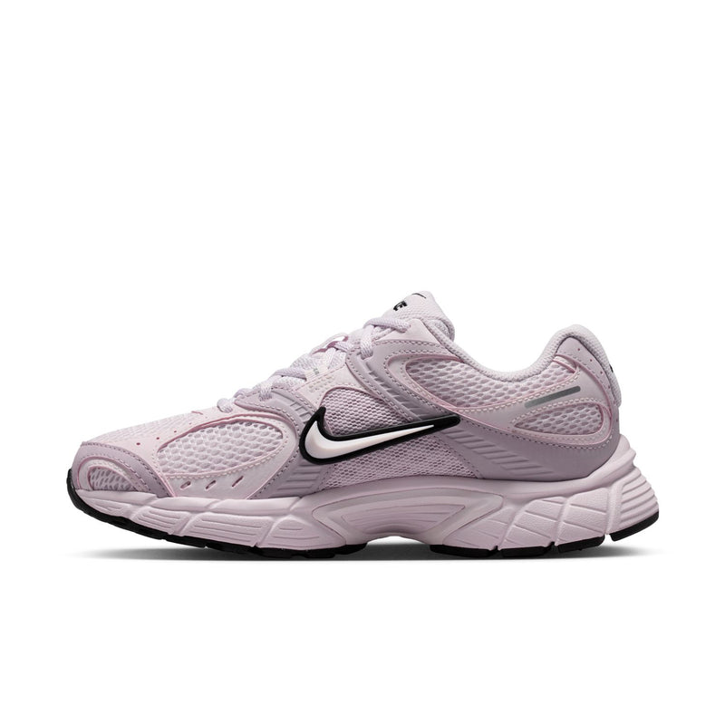 Lilac Nike running sneaker with black Swoosh and textured mesh upper
