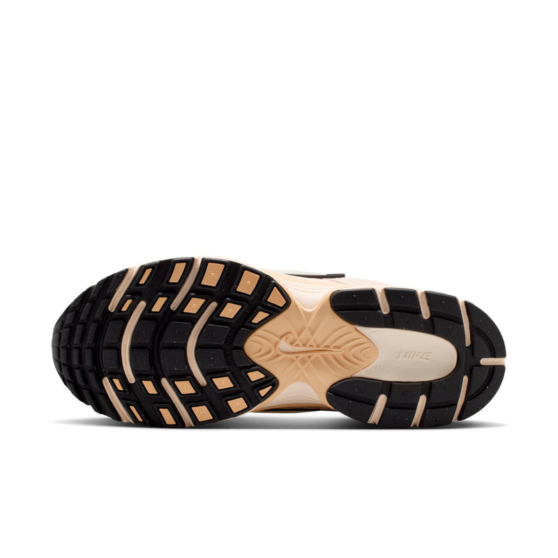 Outsole of pale pink running shoes with black tread and beige rubber base