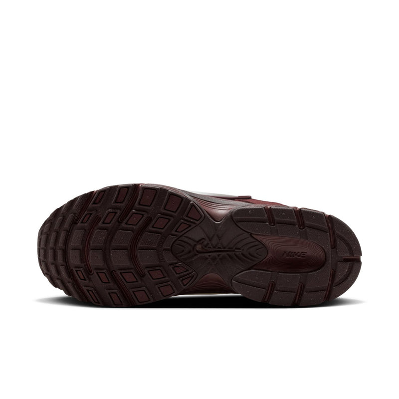 Women's burgundy sneakers with patterned rubber outsole and traction grooves