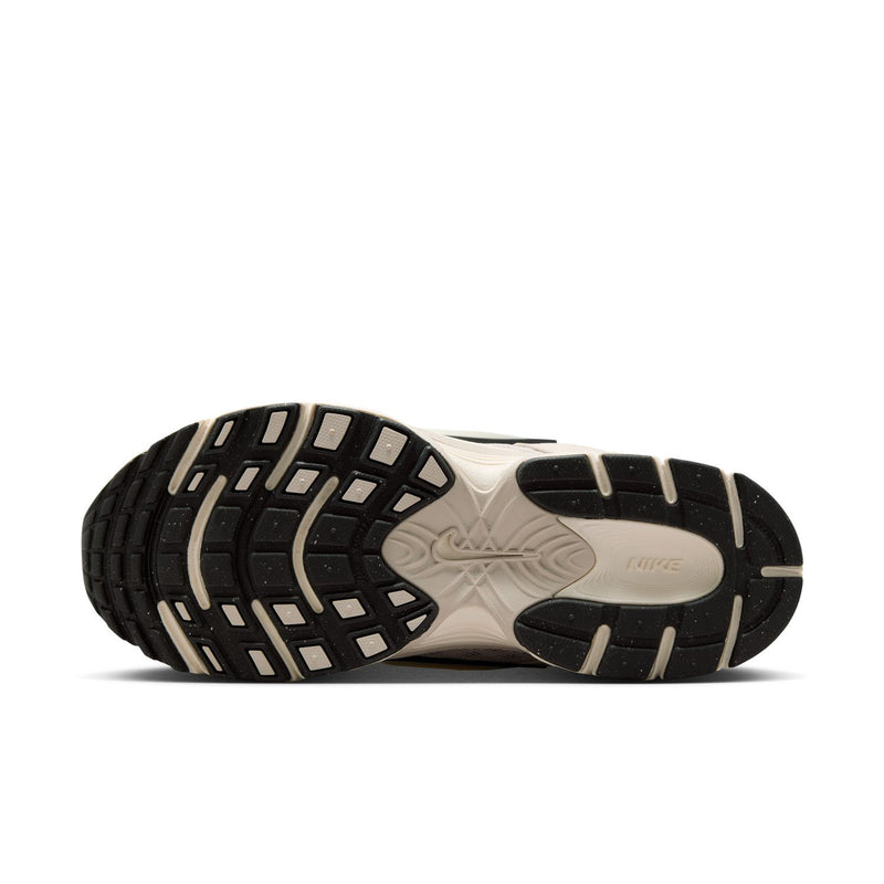 Womens cream running sneaker outsole with textured tread and black edge panels