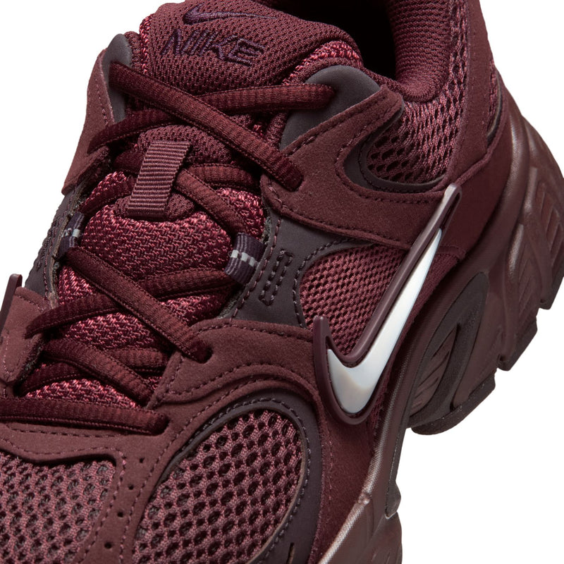 Women's burgundy sneakers with laces, mesh, suede overlays, and Nike swoosh