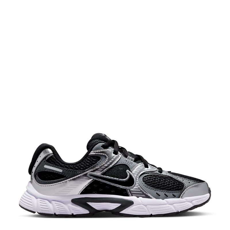 Black and silver youth running shoes with Nike swoosh and lace-up design