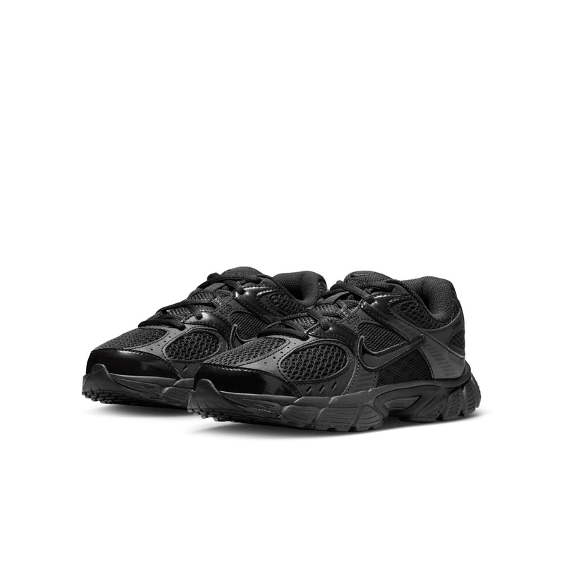Youth black running shoes showing side profile, mesh panels, and lace-up design.
