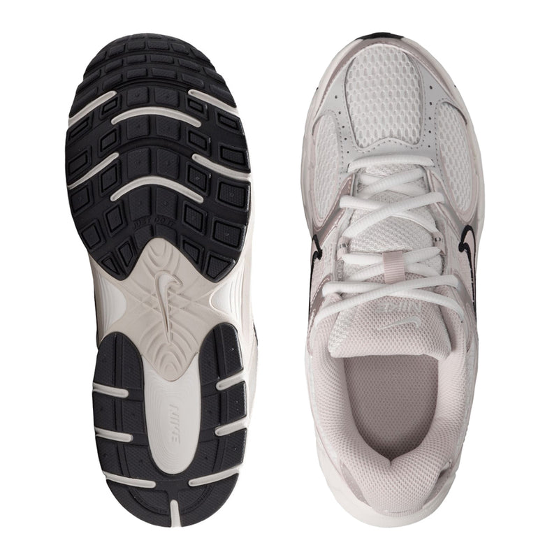 Youth sneaker pair, outsole and inner side view, light upper and dark traction tread