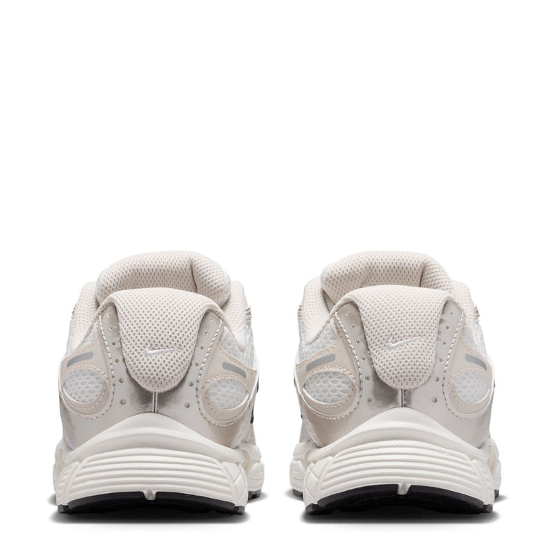 Youth white sneaker heels view, cushioned collar and padded back