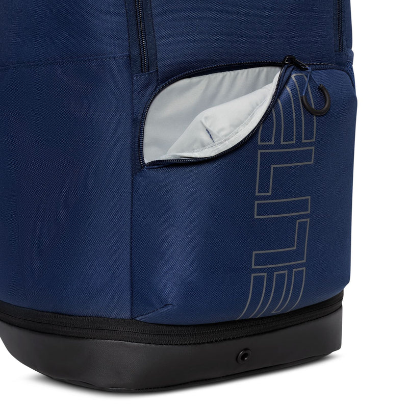 Navy varsity-style backpack with front zip pocket and white-lined compartment, black base
