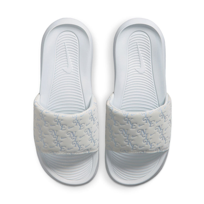 Pair of women’s slide sandals with light gray monogram-pattern straps