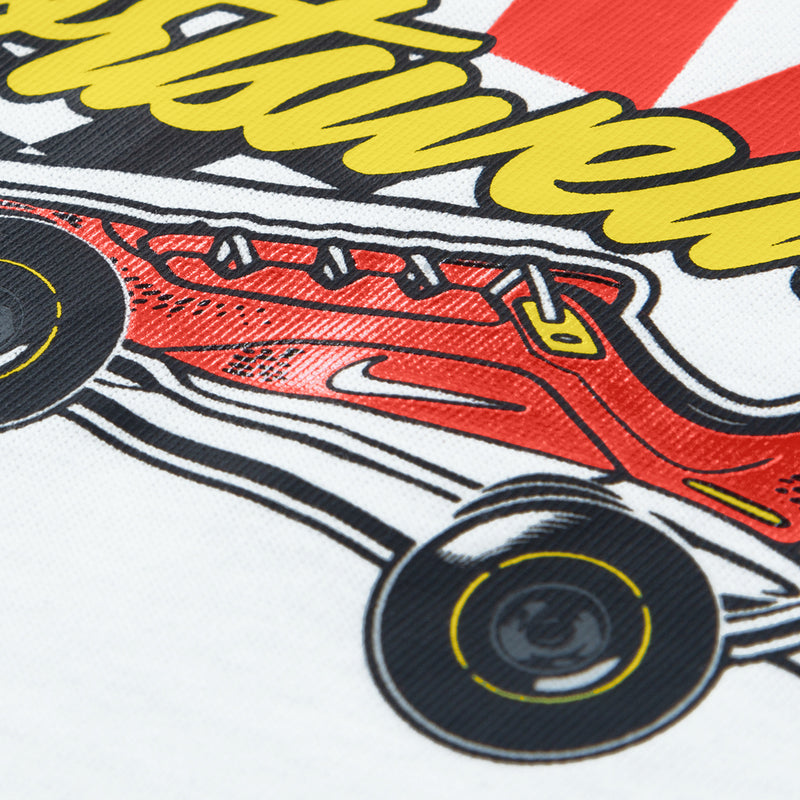 Toddler T-shirt graphic close-up with red engine, yellow flames, and black wheels