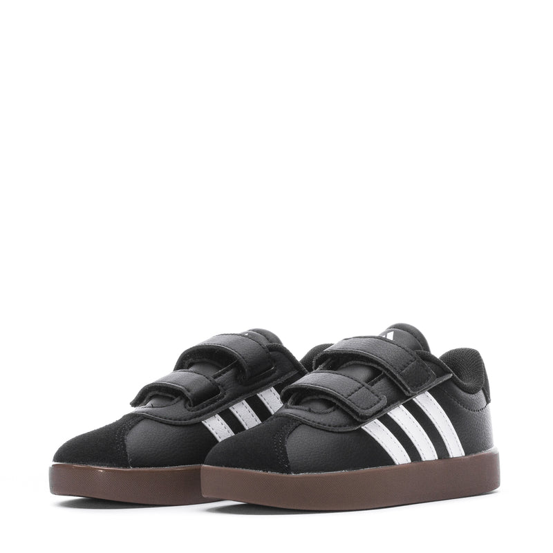 Pair of toddler black adidas sneakers with white side stripes and Velcro closures