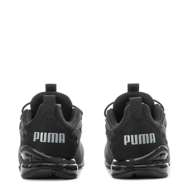 Kids black running shoes, heel back view with PUMA lettering