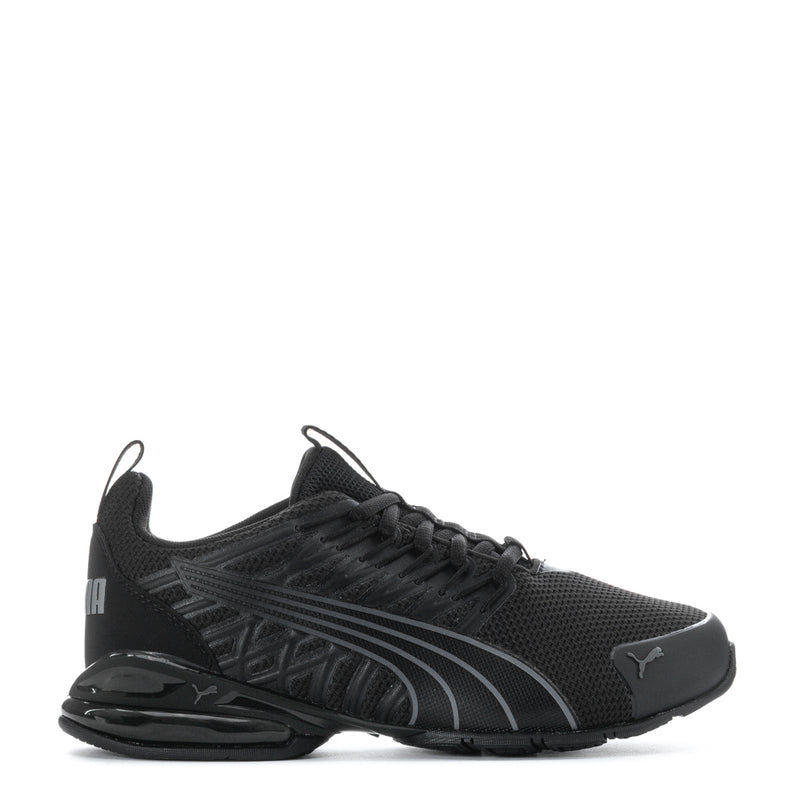 Black youth athletic sneakers with Puma logo, lace-up mesh upper and sculpted sole