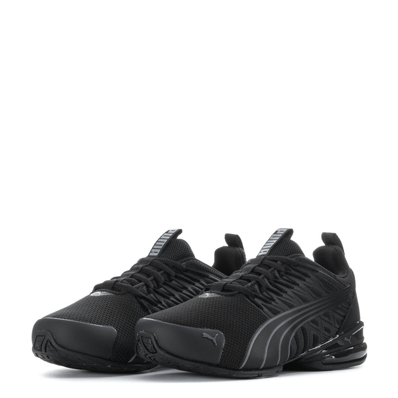 Pair of black youth athletic sneakers with mesh texture, laces, and Puma side branding