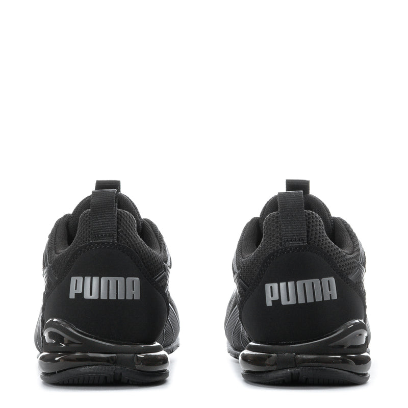Black youth sneakers heels with Puma wordmark and cushioned air sole