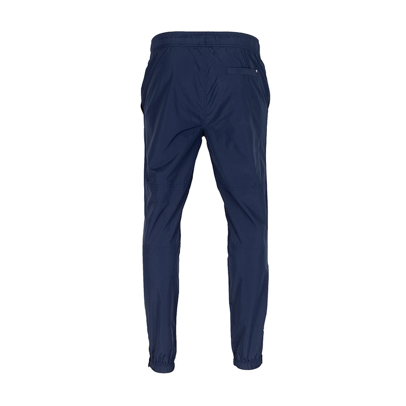 Men's navy wind pants, back view, elastic waistband and tapered legs