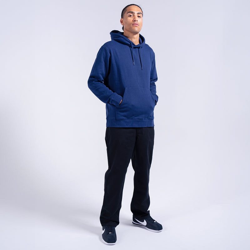 Men's dark work pants on model, straight-leg fit with ankle openings