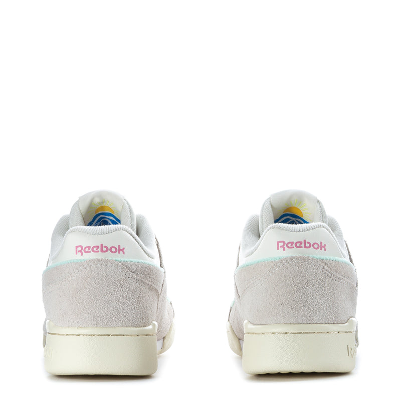 Youth sneakers heel view with Reebok logo, light gray suede upper, and cream midsole