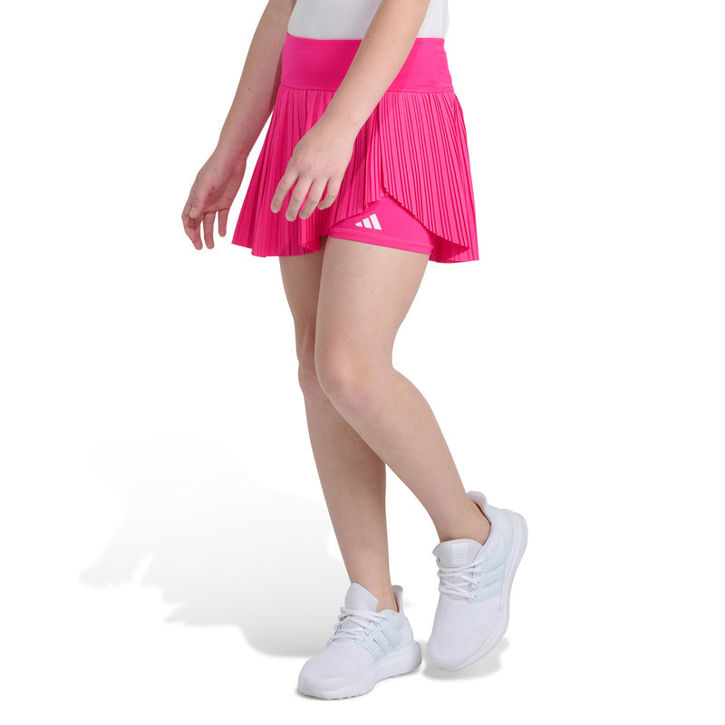 Youth shock pink pleated skort with elastic waistband and three-stripe logo hem