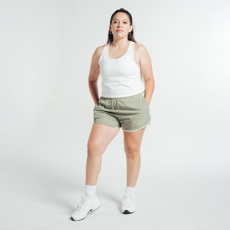 Women’s sea spray running shorts with elastic waistband, worn with a white tank
